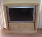 Oak T V Cabinet. Panelled doors opening and sliding internally